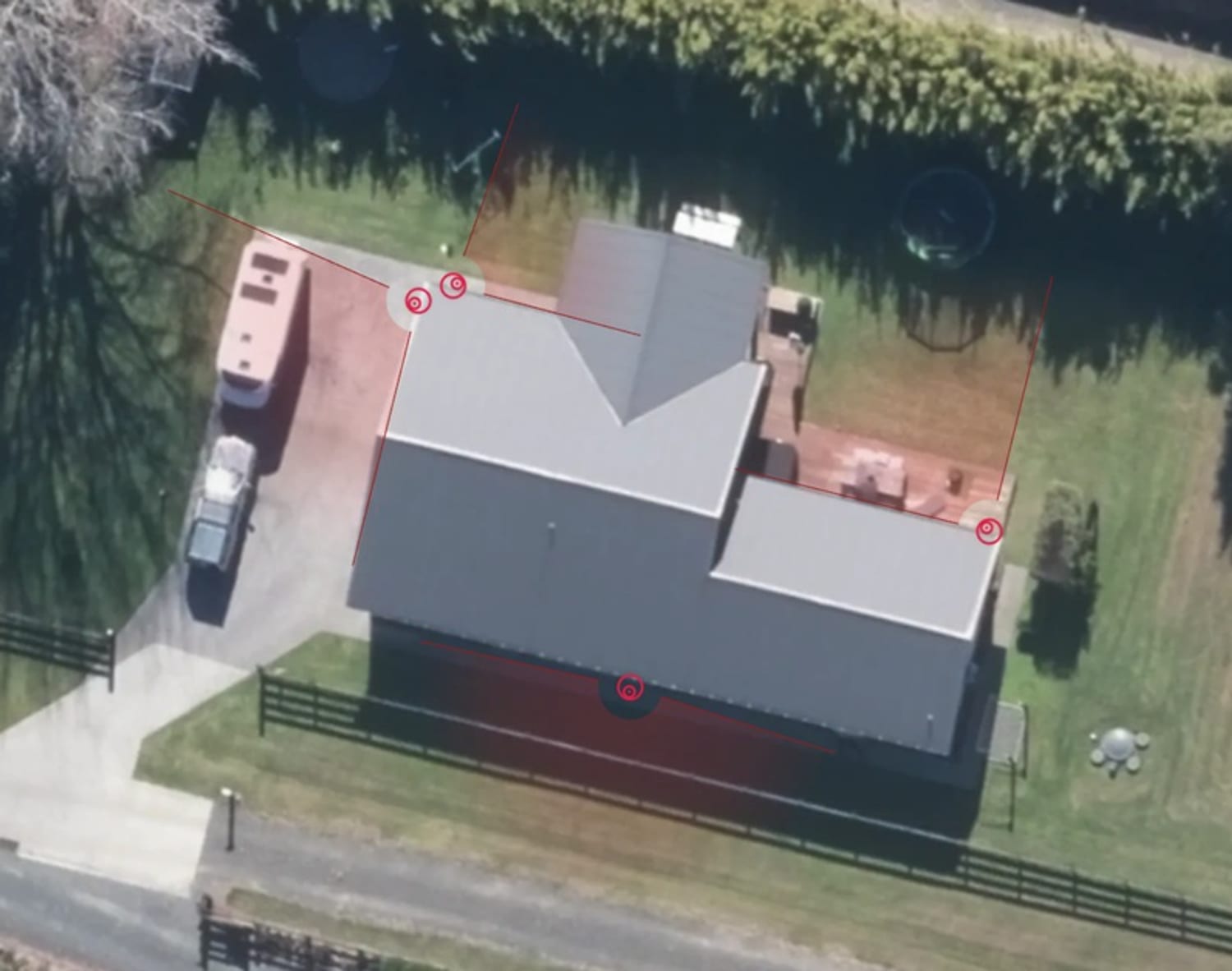 A property aerial open in Knack with CCTV cameras placed and red coverage cones fanned across the site